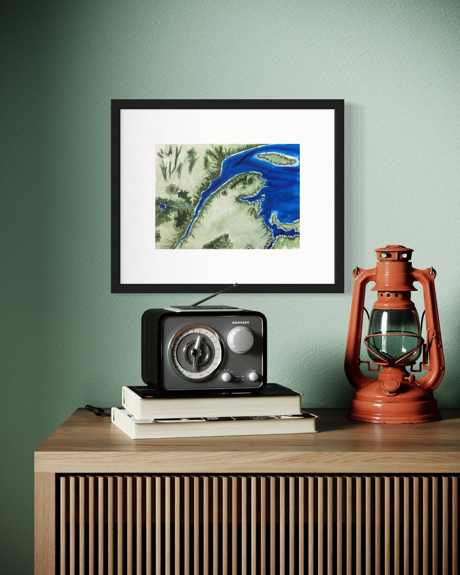 Watercolour hand painting of the St. Lawrence River with deep blues and greens. Style is reflective of earlier types of maps with lines along the shore for representing elevation. Parts of Eastern Canada are visible, and the Sagueny River is visible.