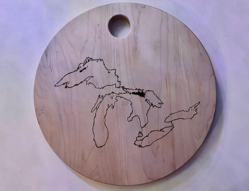 Hand burned shoreline of the Laurentian Great Lakes on a Canadian Maple wood. Sanded and finished with Walrus Food Safe Oil. Features Lake Superior, Lake Huron, Lake Michigan, Lake Ontario, and Lake Erie.